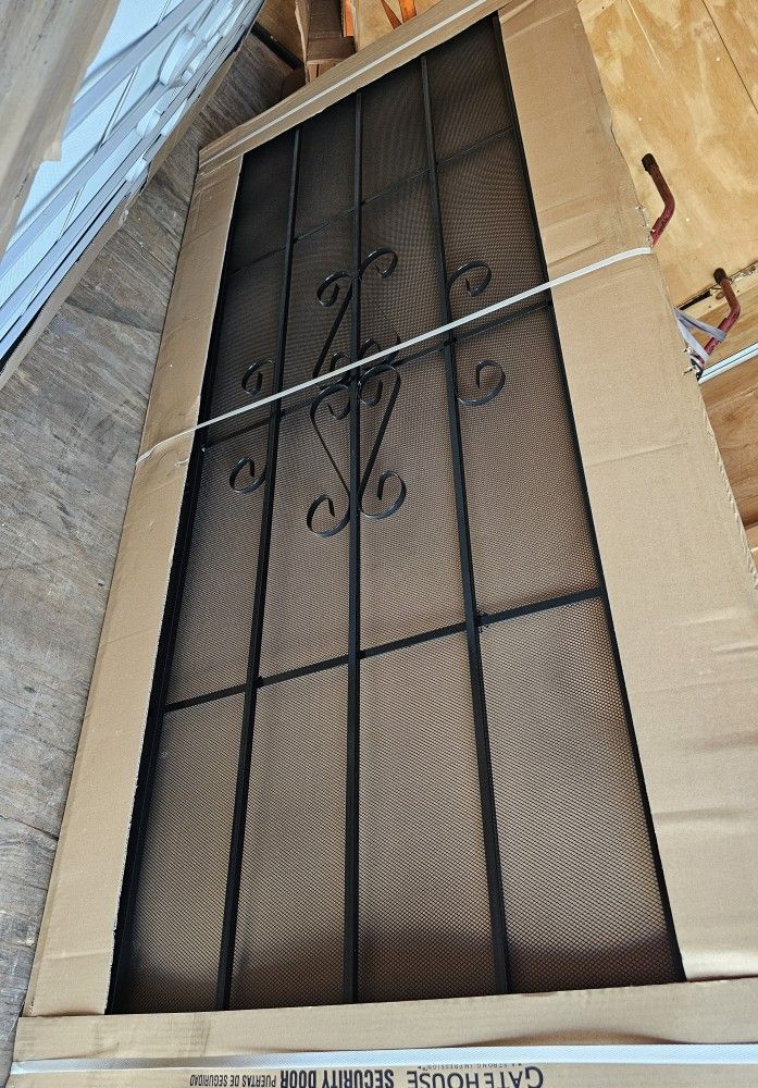 BLACK STEEL SURFACE SECURITY DOOR WITH SCREEN....36" x 80".....NEW.....$ 200