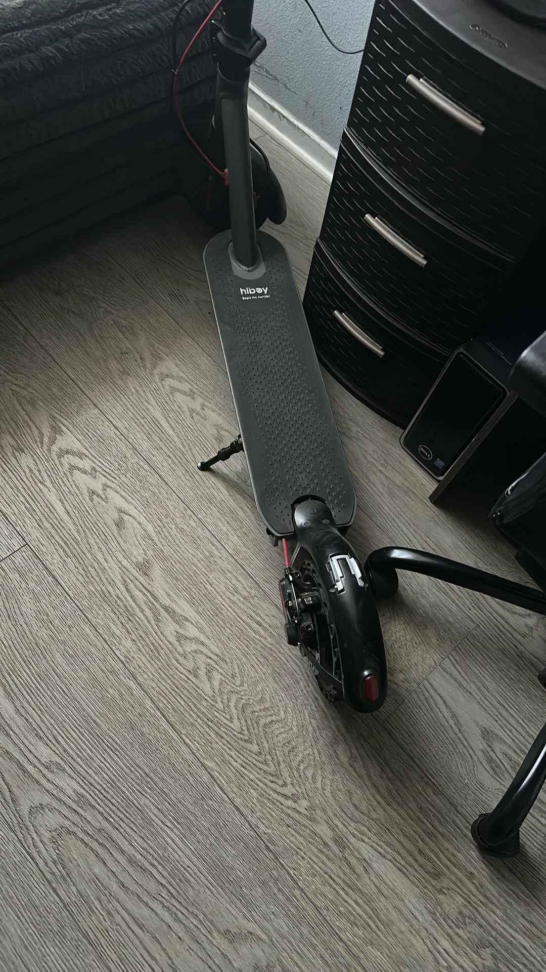 Electric Scooter. It Works Perfect Perfectly. He Has No Issues With It.