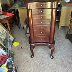 a nice jewelry cabinet its 40 inches tall 18 inches tall and 14 inches wide