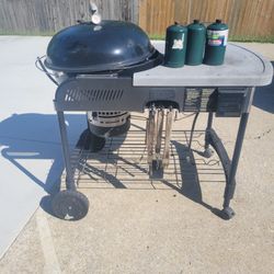 Used WEBER CHARCOAL AND GAS GRILL.