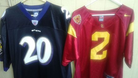 Baltimore Ravens NFL jersey and a USC college jersey