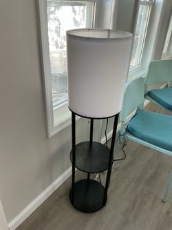 A nice, 2 shelves , floor lamp (missing 3 bottom screws )