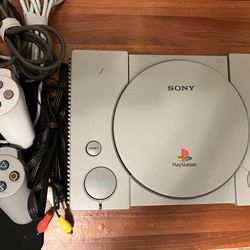 PS1 with controllers and games