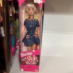 1997 Mattel Style Barbie doll, model #18219.  The doll has blonde hair and blue eyes.  It is wearing a country-chic denim dress with red plaid accents