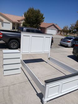 White wooden bed frame and dresser set