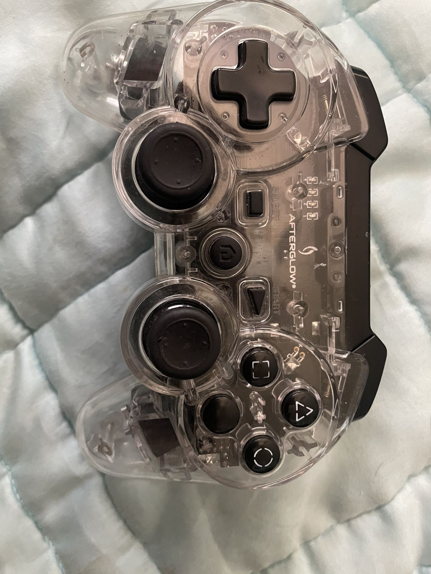 Afterglow PlayStation three controller no damage shown buttons do not stick. Everything works great.