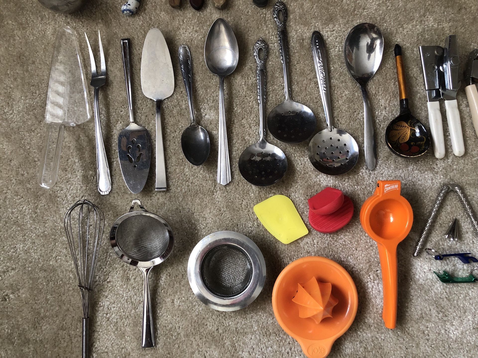 Kitchen utensils: knives, spoons, forks, grater, funnel