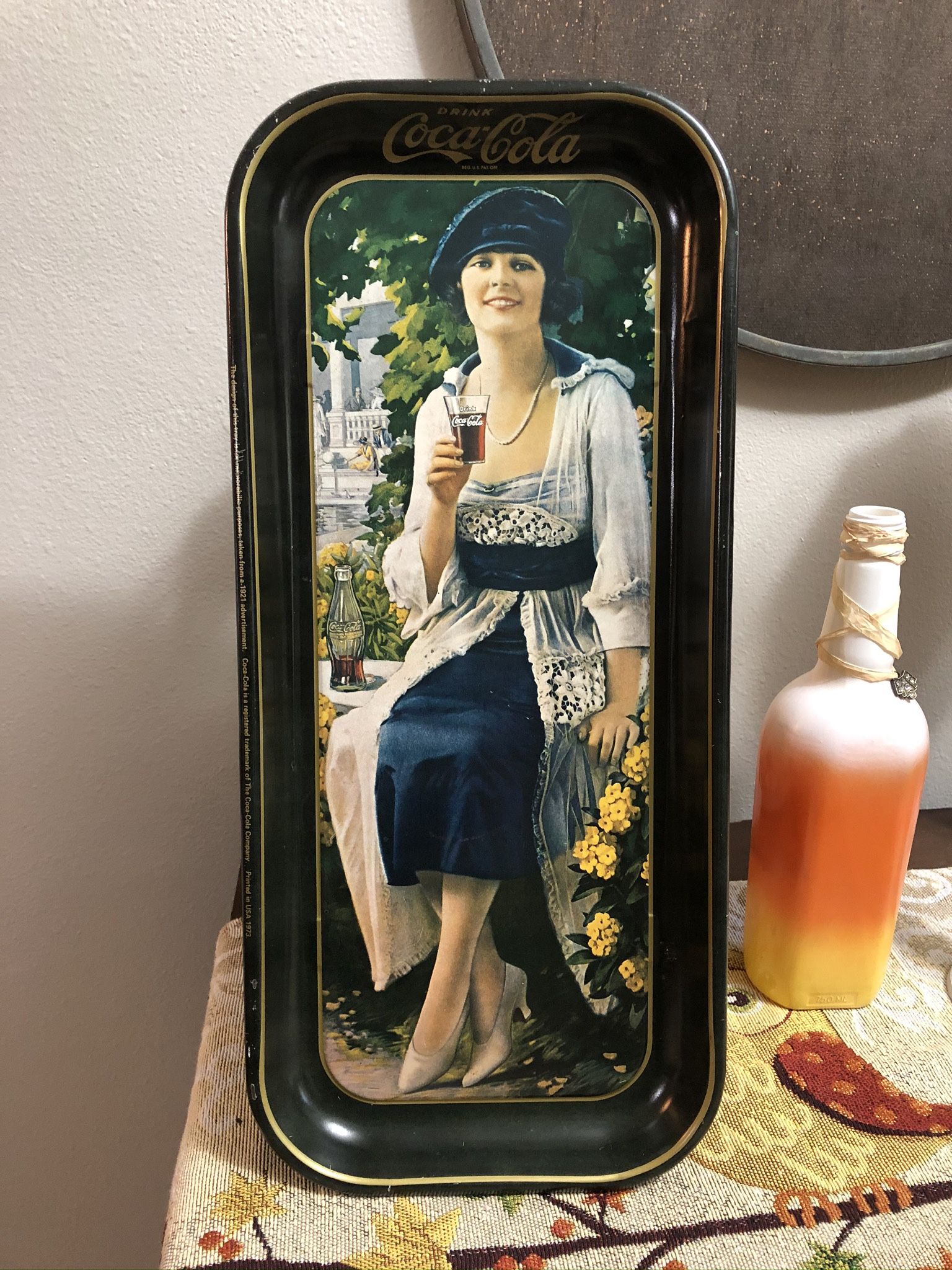 vintage Coca-Cola serving tray, specifically a 1973 reproduction of a 1921 advertisement