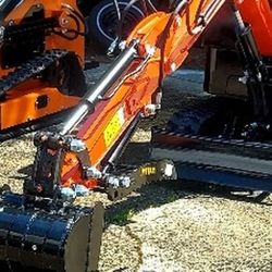 Mini Excavator  / Skid Steer---  New $6000 Each or $11,500 For Both