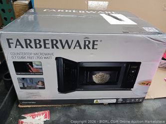 Farberware 0.7 Cu. Ft. Countertop Microwave Oven – 700 Watts Power, Auto Cook Settings $35