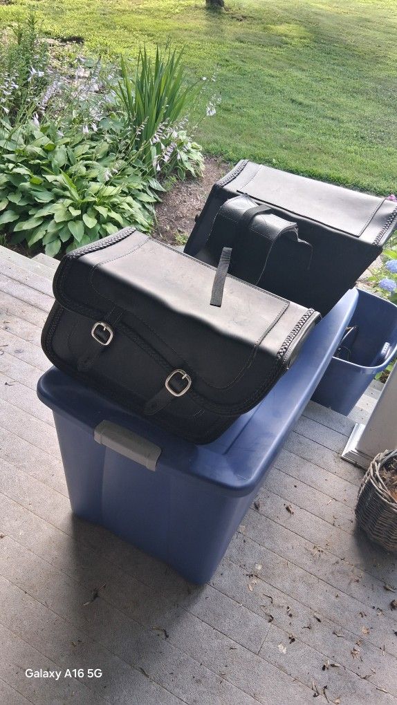 pair of leather  motorcycle saddle bags . 