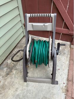 Great hundred foot water hose with  it’s cart