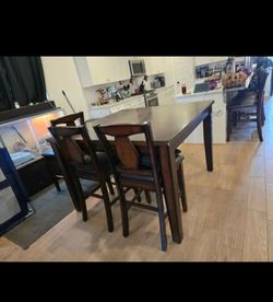 Tall dinning room table with 6 chairs