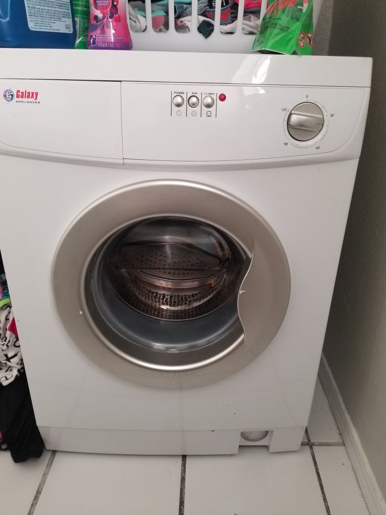 Galaxy Appliances front load washer and electric dryer . 24 in wide small for apartment or dorm .