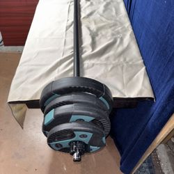 Barbell With 50 Lbs Of Weight 