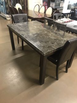 Marble dining set with two chairs.