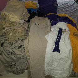 CMIT south Uniforms & 2 duffle Bags. Eropostel and Old Navy pants size 12, 3 M Jackets,14 purple and Yellow Shirts w/ logo, white Shirt w/ tie 