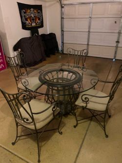 Glass iron table with cloth chairs