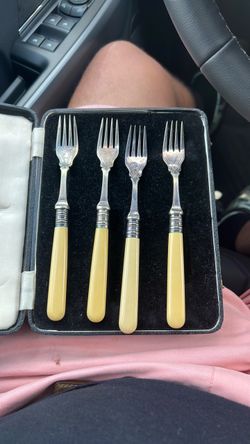 ornate silver-plated pastry or dessert forks