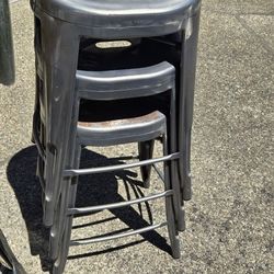 Set of four matching Metal bar stools that stack