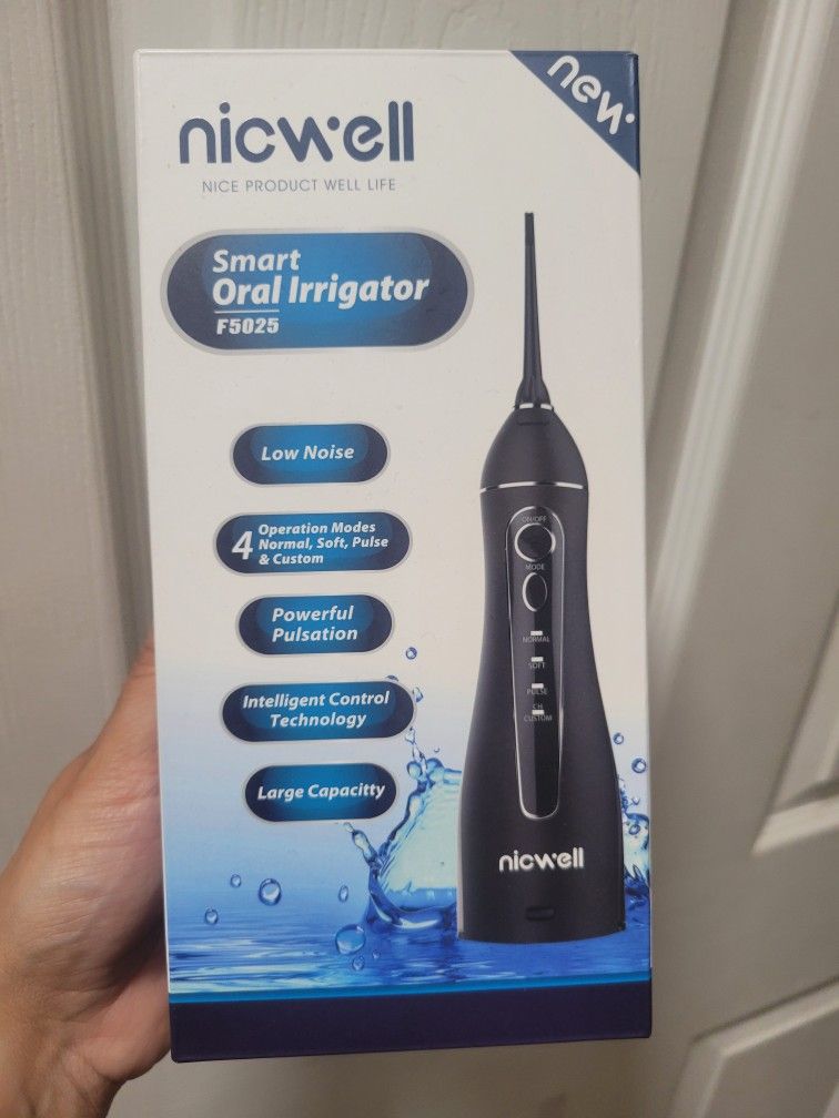NEW DENTAL IRRIGATOR