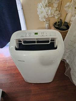 AIR CONDITIONER PORTABLE TOUCH SCREEN TOSHIBA LIKE NEW 6000 BTU FOR ROOM 260 SQ FT,3IN1 COMES WITH EXHAUST TUBE AND WINDOW COVER FOR ANY QUESTION TEXT