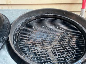 Charcoal grill is in good condition and cover