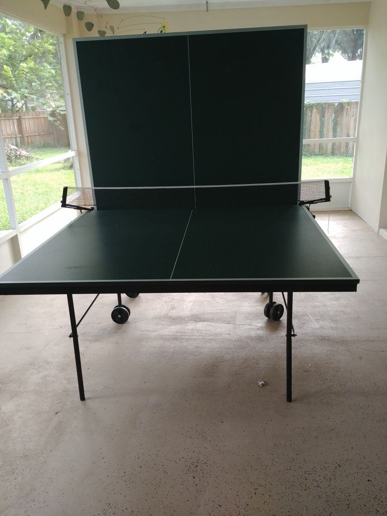 Full size, Butterfly folding/rolling ping pong table for Sale in Land O