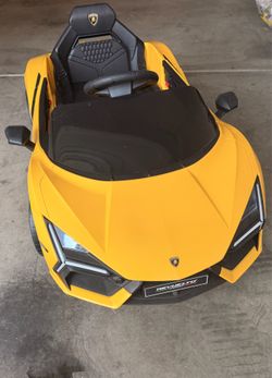 Lamborghini Electric Vehicle with Scissor Door,Kids Cars to Drive with Remote Control,12v Ride On Toys with LED Light,Bluetooth,MP3 Player and Wide Se