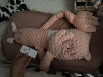Plushy animal pats baby to sleep
