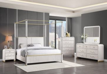 Striking Canopy bedroom set featuring acrylic posts accented with gleaming gold trim