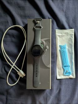 Google Pixel Watch 3 with extra blue band and charger