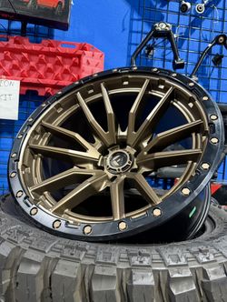 New: FUEL REBEL 22x12 6x139.7 Bronze Wheels & 35x12.50-22 Tires (We Finance)