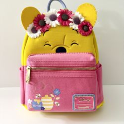 BRAND NEW WITH TAGS. DISNEY WINNIE THE POOH FLOWER CROWN MINI LOUNGEFLY BACKPACK FOR SALE. 