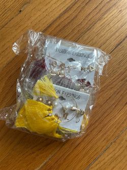 Brand New Fashion Earring Set Never worn, still sealed in original packaging. Comes with a variety of styles (tassel dangles, hoops, and studs). Perfe