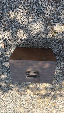 Old school wooden tackle box with lures