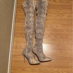 Snake skin thigh high boots