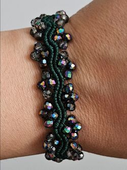Dark green and charcoal gray iridescent beaded macramebracelet