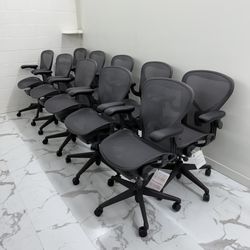 BRAND NEW HERMAN MILLER REMASTERED AERON CHAIRS SIZE B, GRAPHITE COLOR WITH ADJUSTABLE ARMS.