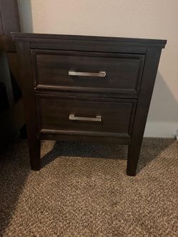Bed with mattress and nightstand
