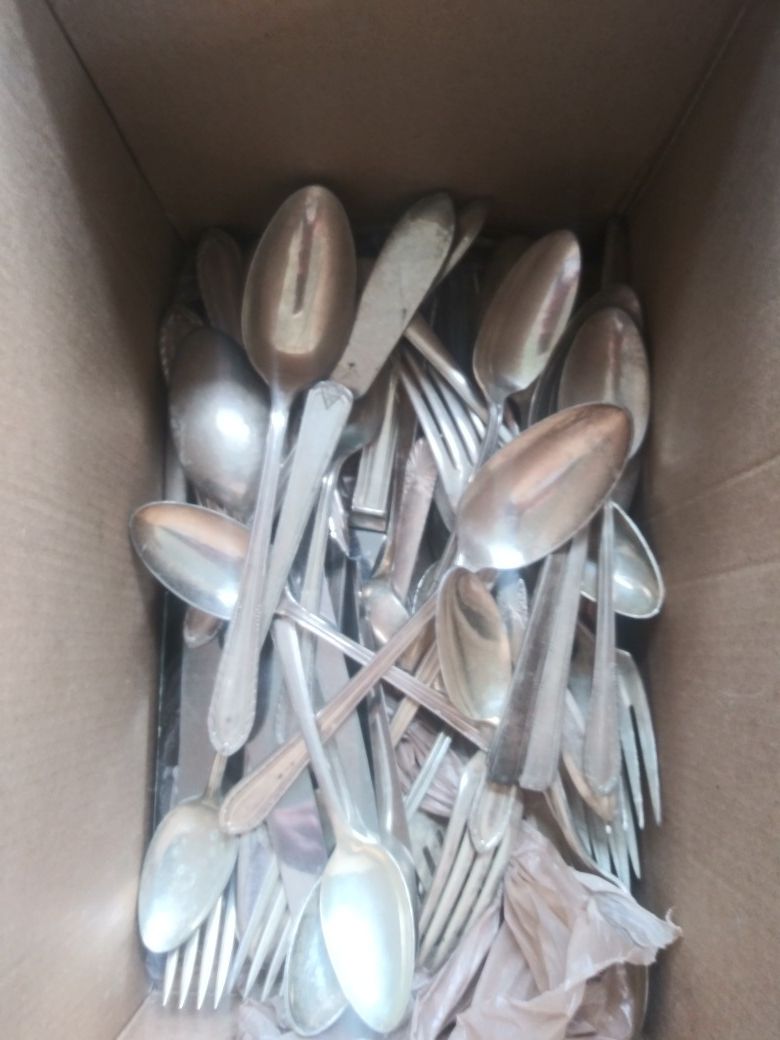 Box of old antique silverware