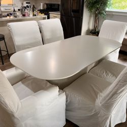 70" Oval Diningx Table, fluted + 6 Pottery barn dining chair.