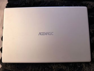 Acemagic AX15 laptop with carrier