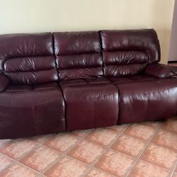 Leather Sofa With Recliners On Each End It Is Burgundy And in Like New Condition 