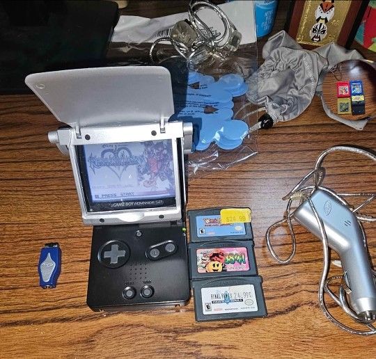 Nintendo Game Boy Advance SP bundle w/ 4 games + car charger + other accessories