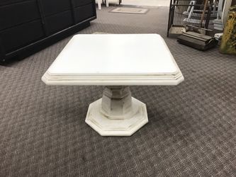 Pedestal antiqued accent table
