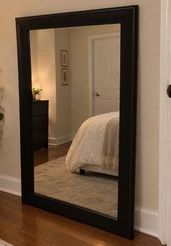 Large black framed mirror in great condition.