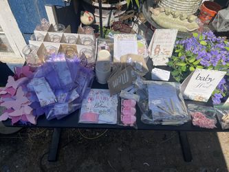 Lots of baby shower party items some used some new.  Never used cups, baby in bloom table toppers, carriages,ivy Other items have been used but in gre