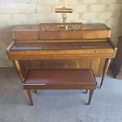 Steigerman upright Piano and Bench. Good Condition, will need to be tuned.