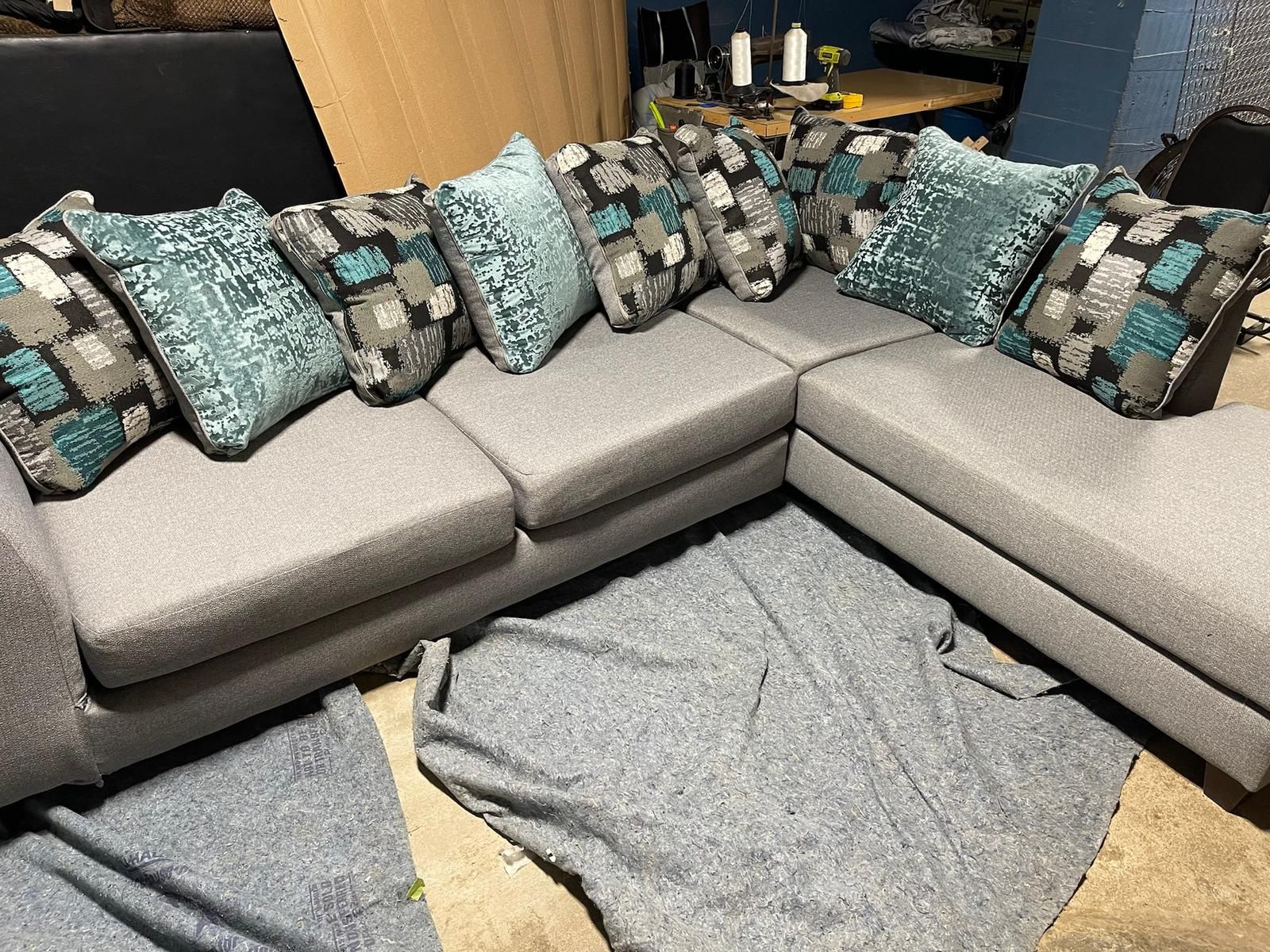 Grey Sectional With Tourquise Pillow